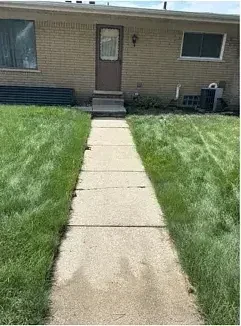 The same walkway after treatment and a surface-cleaner finish