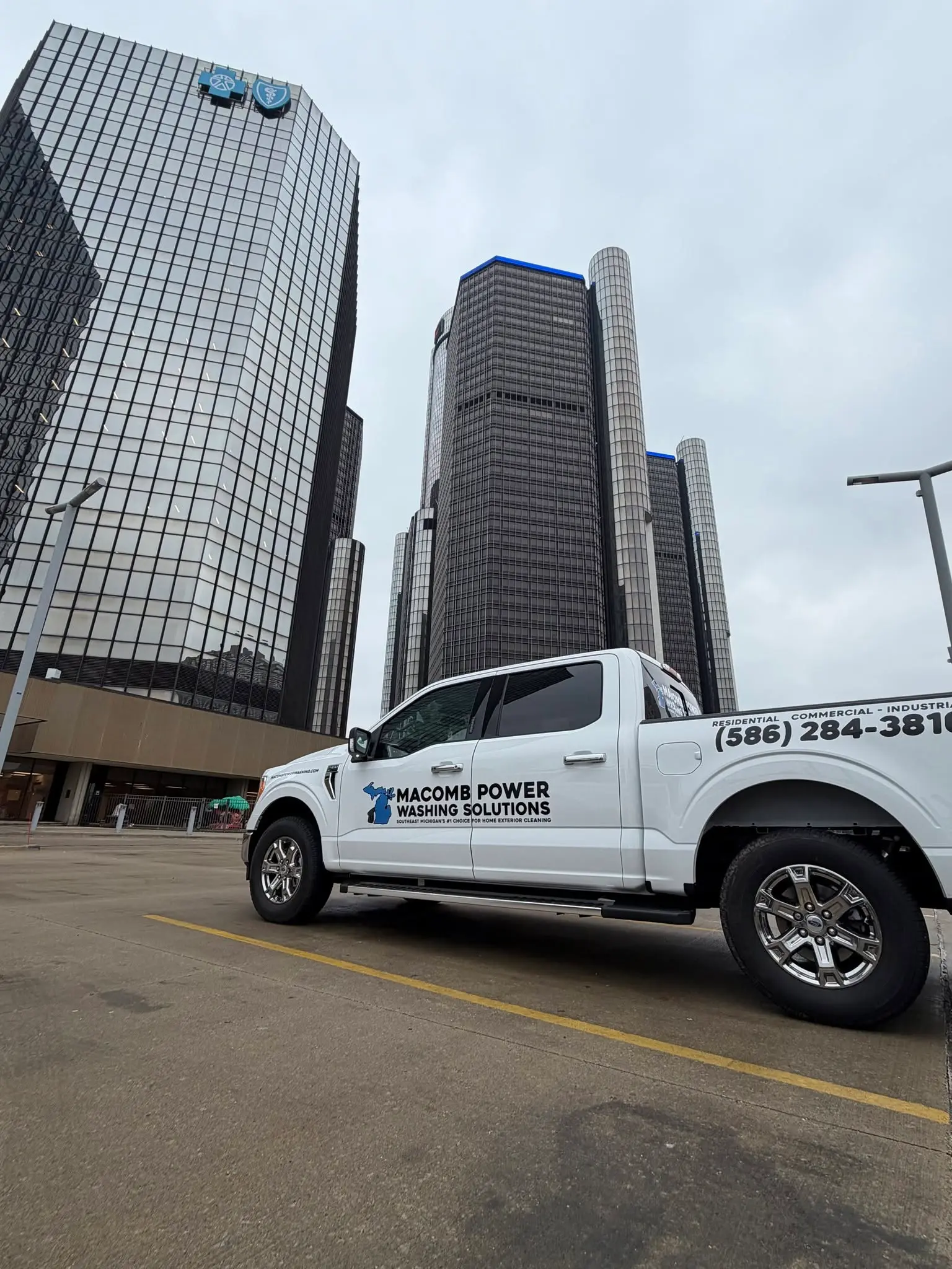 Macomb Power Washing Solutions service truck parked on a job in metro Detroit