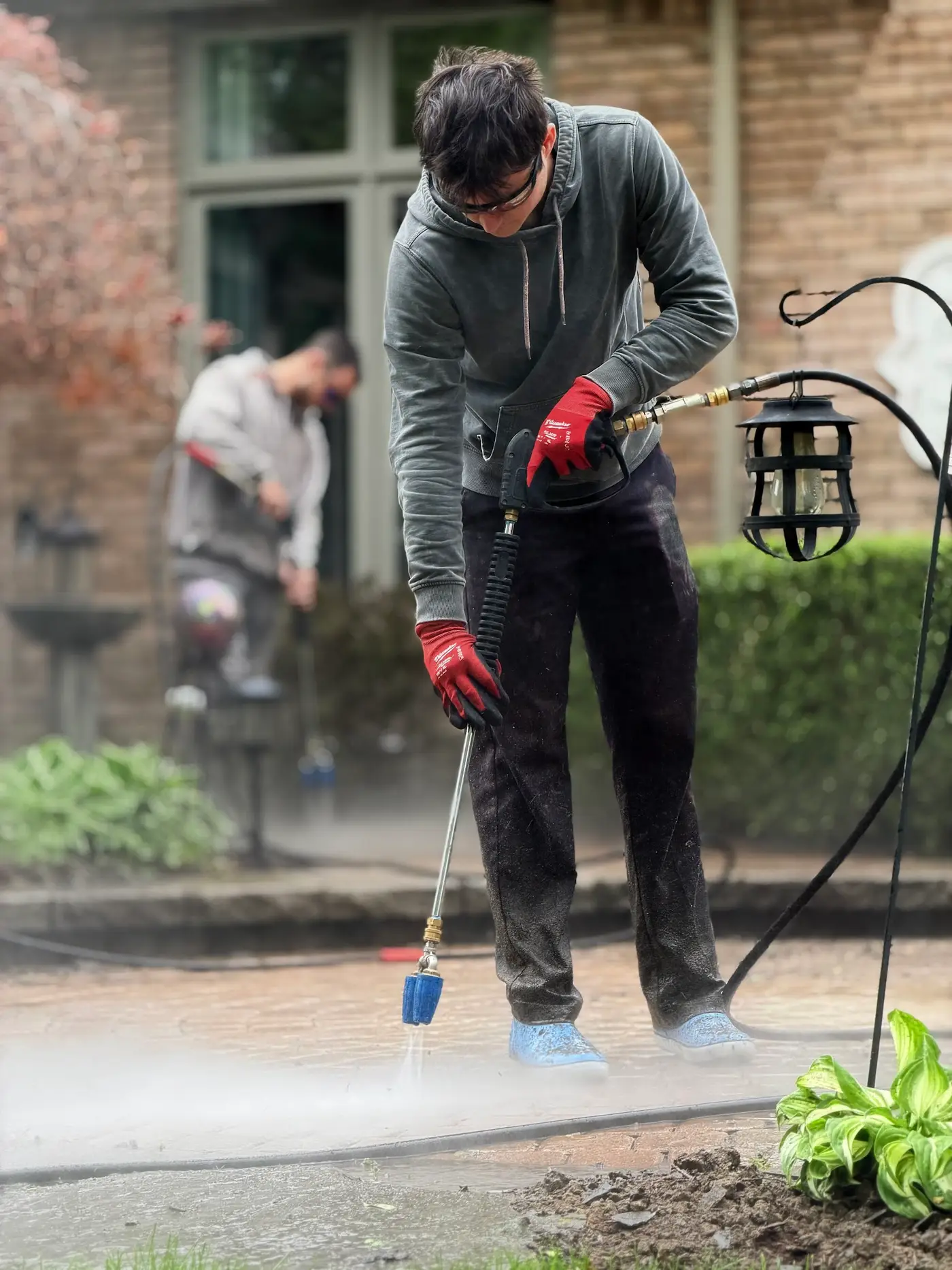 MPWS technician applying a targeted treatment to a stained concrete surface